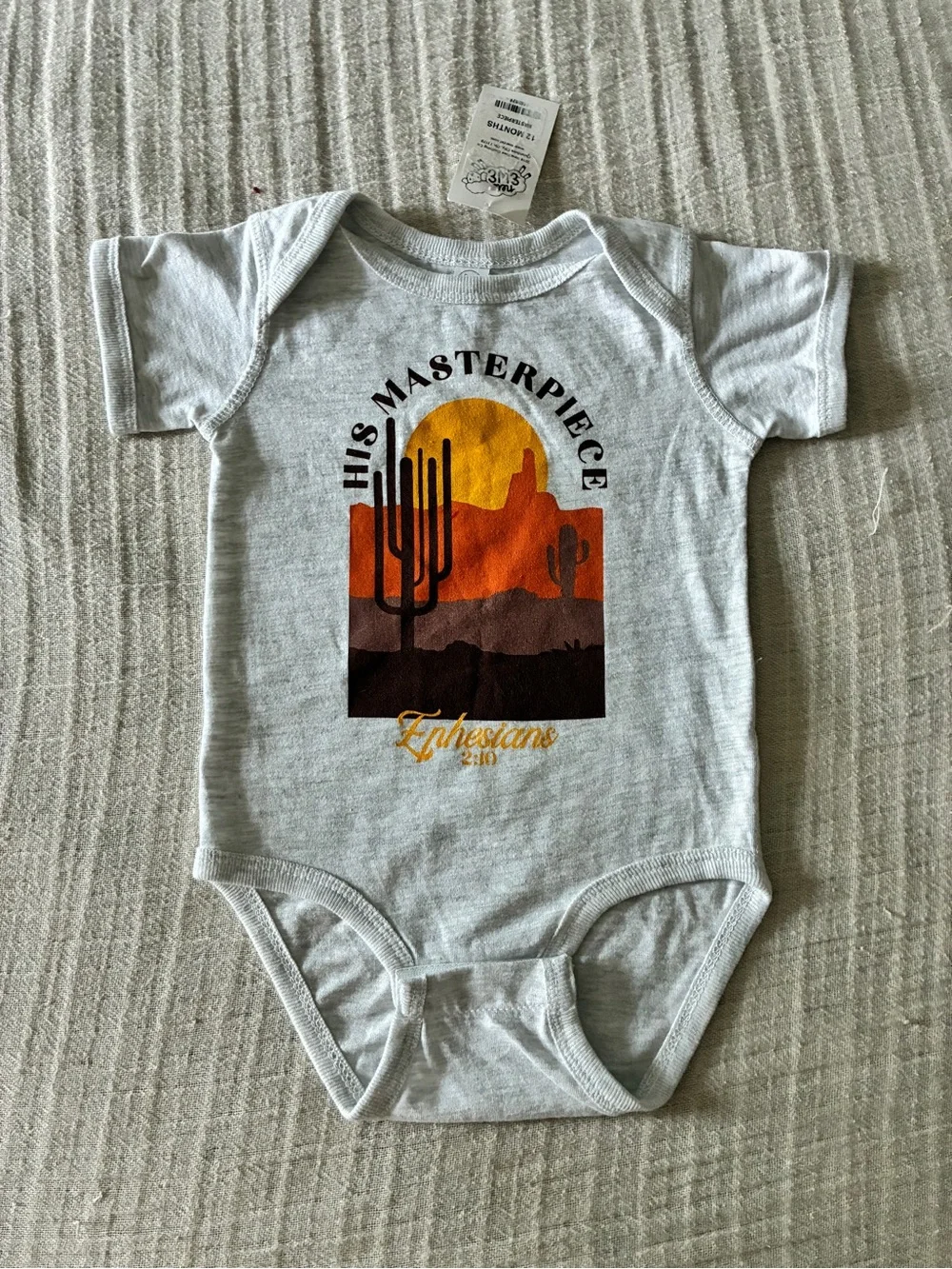 His Masterpiece Ephesians 2:10  Desert Graphic Onesie Heathered Gray, 12 mo NEW!